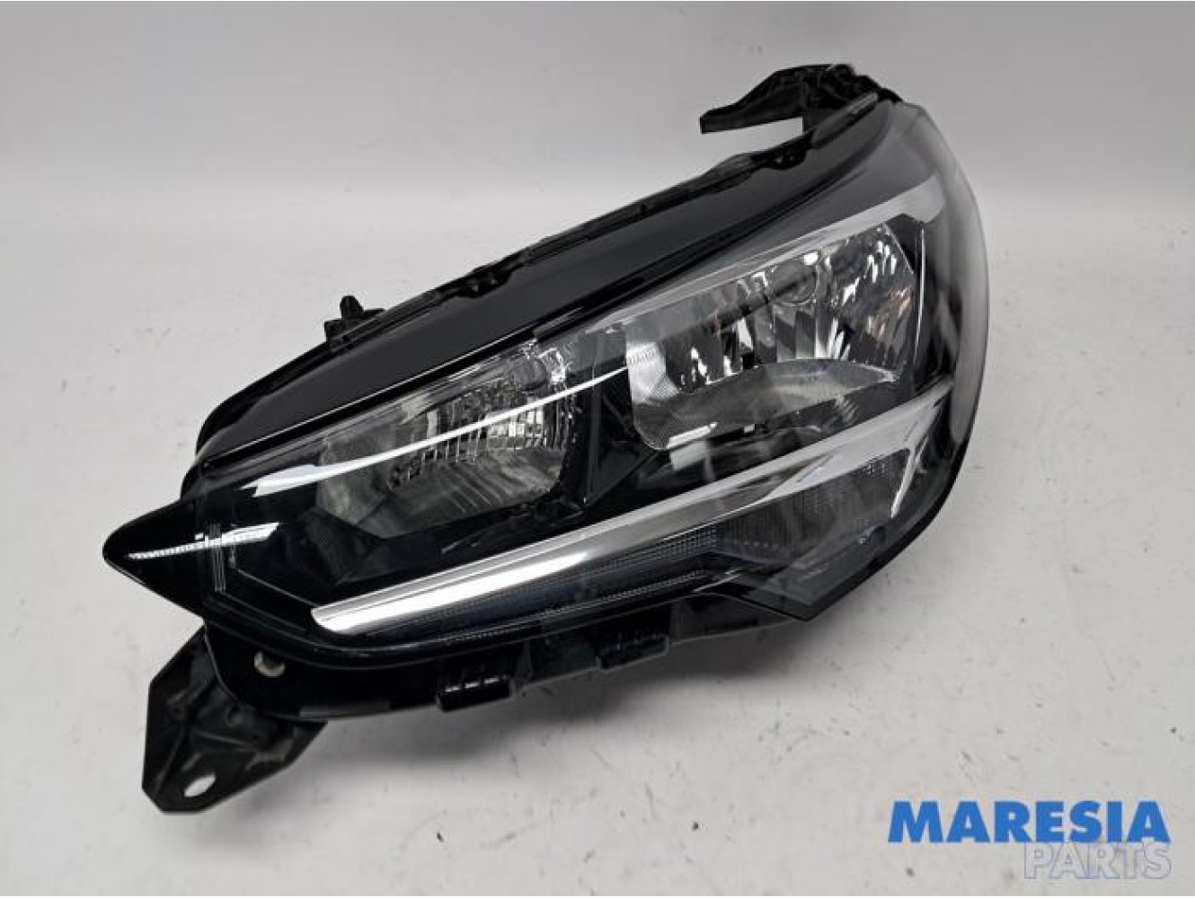 Opel - Corsa - Koplamp links